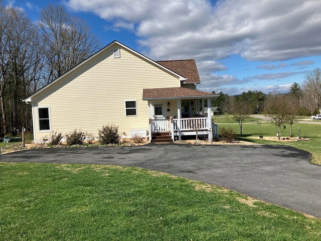24 Pauls Ct, Blairsville, GA 30512 - view of side of property with a yard, roof with shingles, a porch, and driveway