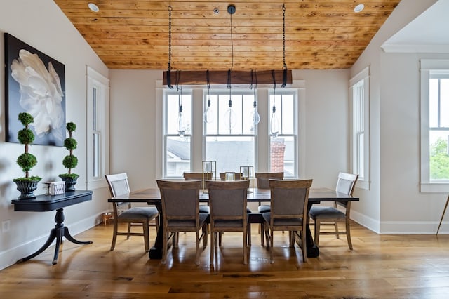 dining area with wooden ceiling, baseboards, vaulted ceiling, and wood finished floors