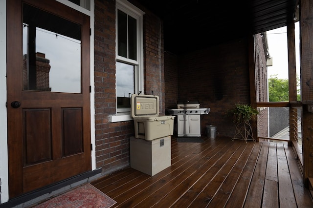 wooden deck with grilling area