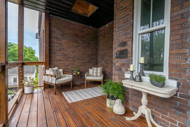 wooden terrace featuring a porch