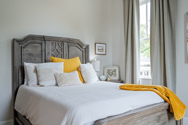 bedroom featuring multiple windows