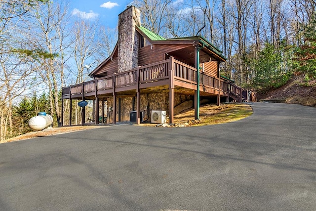 exterior space with central AC and a deck