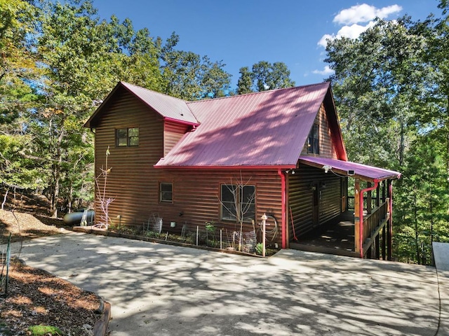 view of home's exterior with a carport