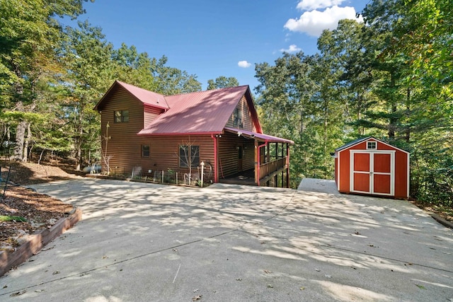 view of home's exterior featuring a storage unit