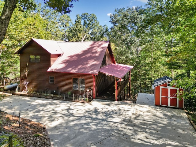 view of property exterior with a shed