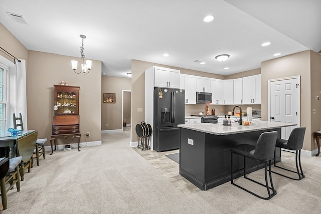 2092 Pleasant Grove Rd, Blairsville, GA 30512 - kitchen featuring appliances with stainless steel finishes, baseboards, white cabinets, an island with sink, and recessed lighting