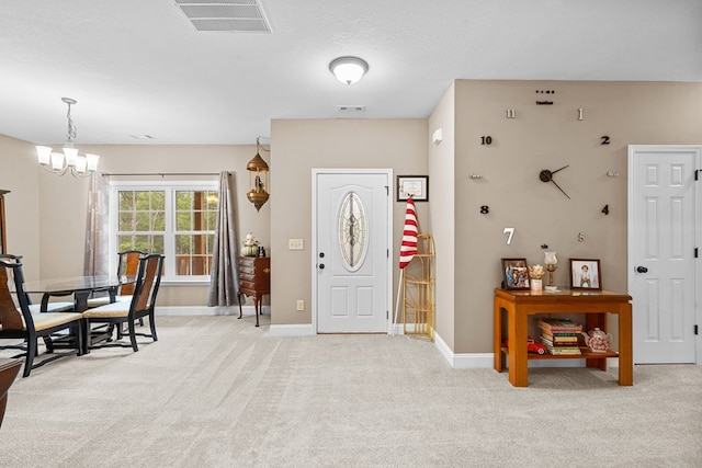 2092 Pleasant Grove Rd, Blairsville, GA 30512 - foyer with light colored carpet, a chandelier, and baseboards