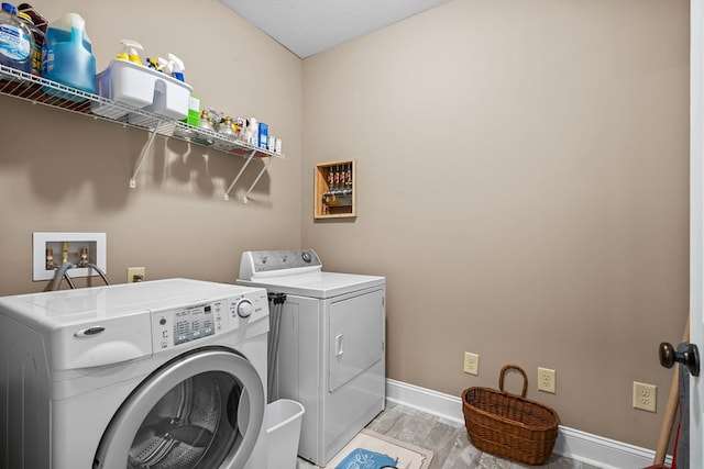 2092 Pleasant Grove Rd, Blairsville, GA 30512 - washroom with independent washer and dryer, baseboards, and light wood-style flooring