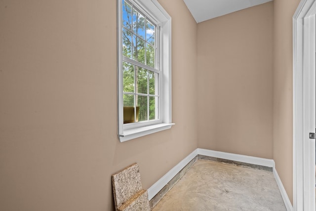 2092 Pleasant Grove Rd, Blairsville, GA 30512 - unfurnished room with plenty of natural light, baseboards, and unfinished concrete flooring