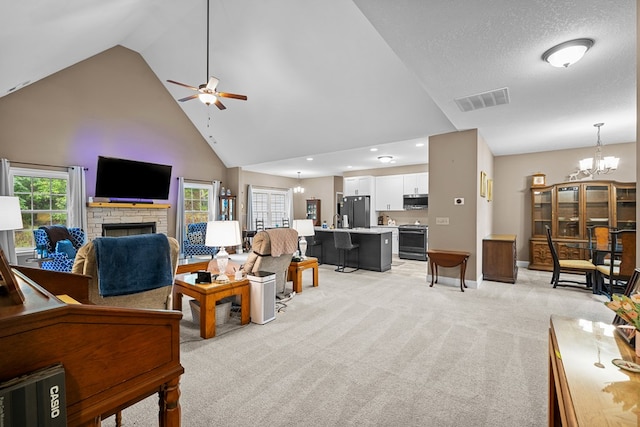 2092 Pleasant Grove Rd, Blairsville, GA 30512 - living room with a fireplace, ceiling fan, high vaulted ceiling, a chandelier, and light colored carpet
