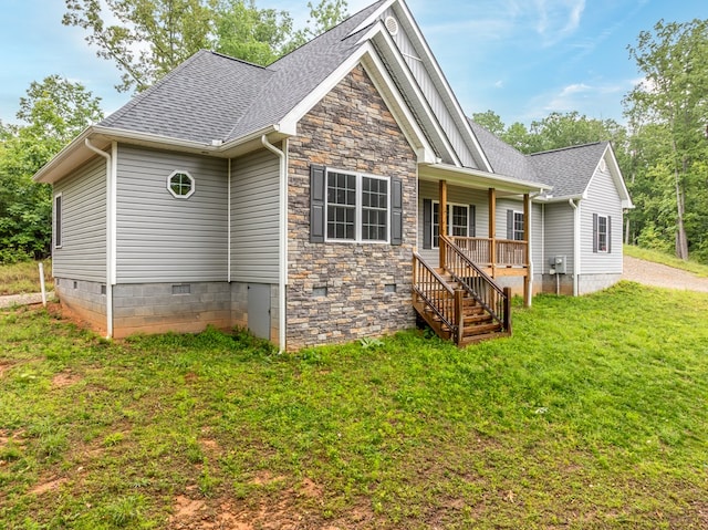 2092 Pleasant Grove Rd, Blairsville, GA 30512 - view of front of property featuring a front yard, a shingled roof, board and batten siding, crawl space, and covered porch