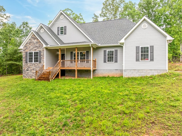 2092 Pleasant Grove Rd, Blairsville, GA 30512 - rear view of house with a shingled roof, a lawn, board and batten siding, stairs, and covered porch