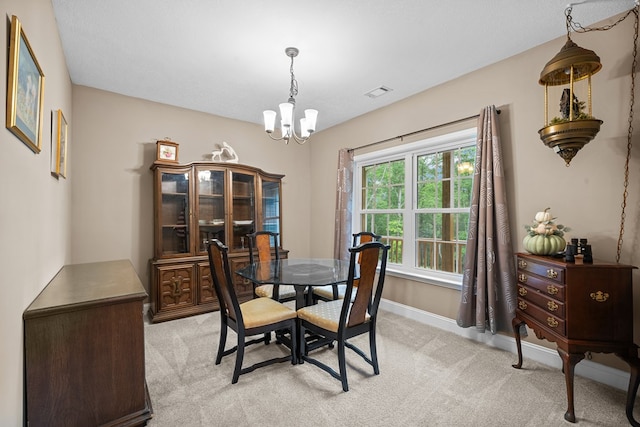 2092 Pleasant Grove Rd, Blairsville, GA 30512 - dining space with a chandelier, light colored carpet, and baseboards