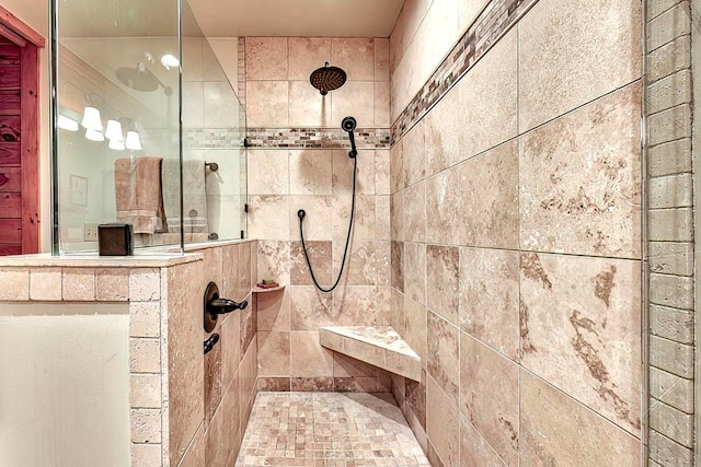 bathroom with a tile shower