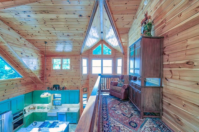 interior space with wood walls, high vaulted ceiling, and wooden ceiling