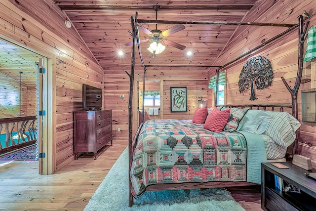 bedroom featuring lofted ceiling, wood walls, wooden ceiling, and light hardwood / wood-style flooring