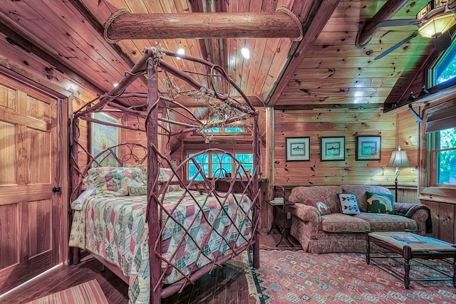 bedroom featuring wood ceiling, wood walls, and multiple windows