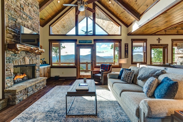 370 High Ridge Rd, Epworth, GA 30513 - living room featuring ceiling fan, a stone fireplace, wood finished floors, wooden ceiling with exposed beams, and high vaulted ceiling