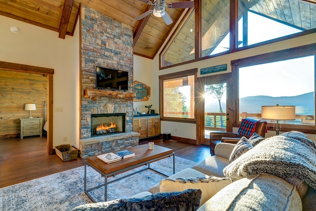 370 High Ridge Rd, Epworth, GA 30513 - living room featuring wood ceiling with exposed beams, ceiling fan, wood finished floors, high vaulted ceiling, and a stone fireplace