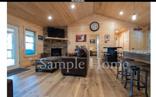 living room with vaulted ceiling, wood walls, wood ceiling, and light hardwood / wood-style flooring