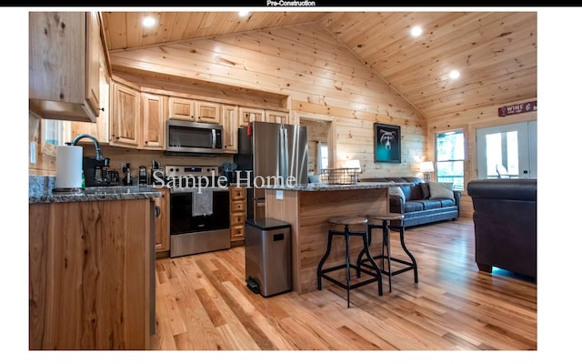 kitchen featuring light hardwood / wood-style flooring, dark stone countertops, wooden ceiling, wooden walls, and stainless steel appliances