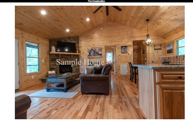 living room with wooden ceiling, light hardwood / wood-style floors, and wood walls