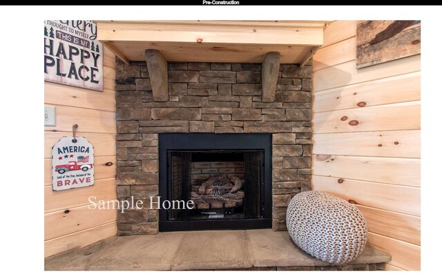 details with a fireplace and wooden walls