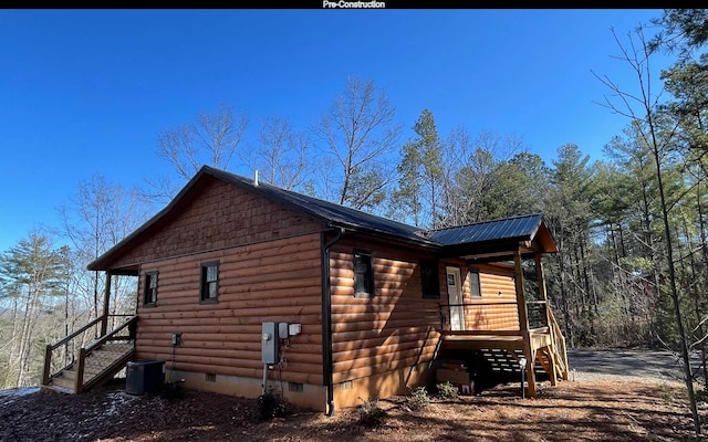 view of side of property featuring cooling unit