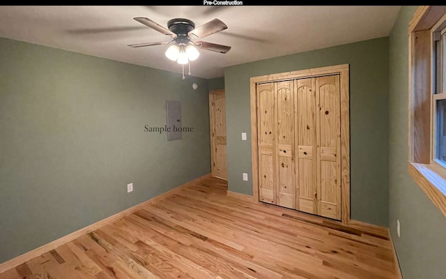 unfurnished bedroom with ceiling fan, a closet, and light wood-type flooring