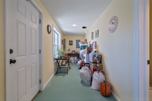 hall with carpet flooring