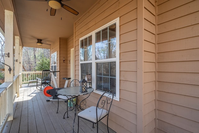 wooden terrace featuring ceiling fan and covered porch