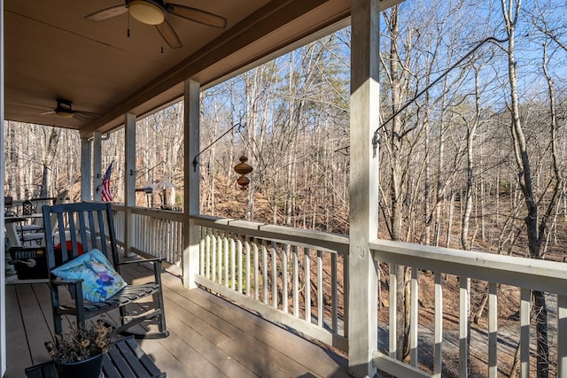 wooden terrace featuring ceiling fan