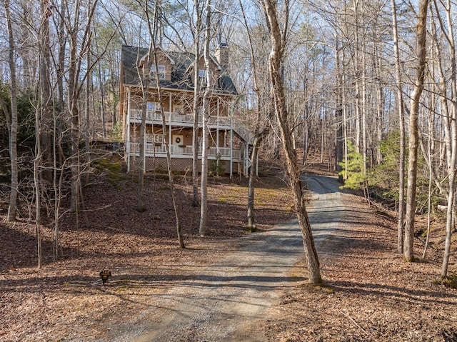 view of front of house featuring a balcony