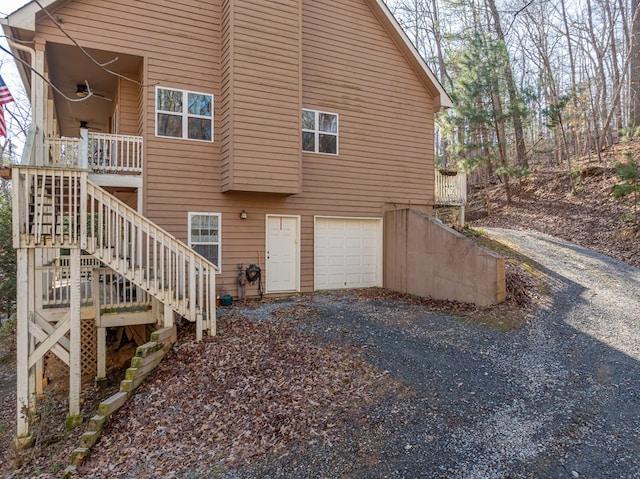 back of house featuring a garage