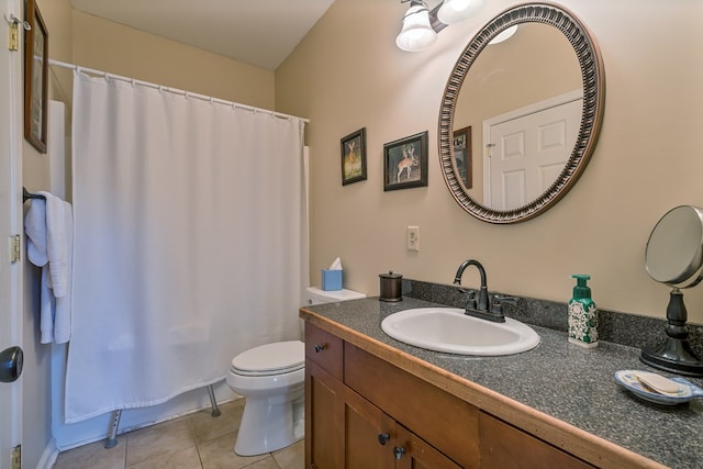 bathroom with tile patterned floors, toilet, and vanity