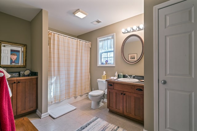 full bathroom with shower / tub combo, vanity, toilet, and tile patterned flooring