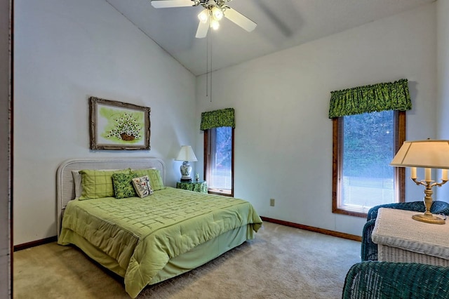 bedroom featuring vaulted ceiling, light carpet, and ceiling fan