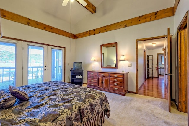 carpeted bedroom with access to exterior, lofted ceiling with beams, and ceiling fan