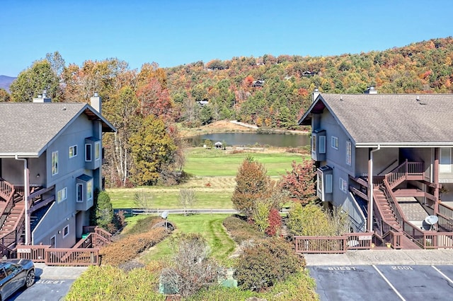 birds eye view of property with a water view