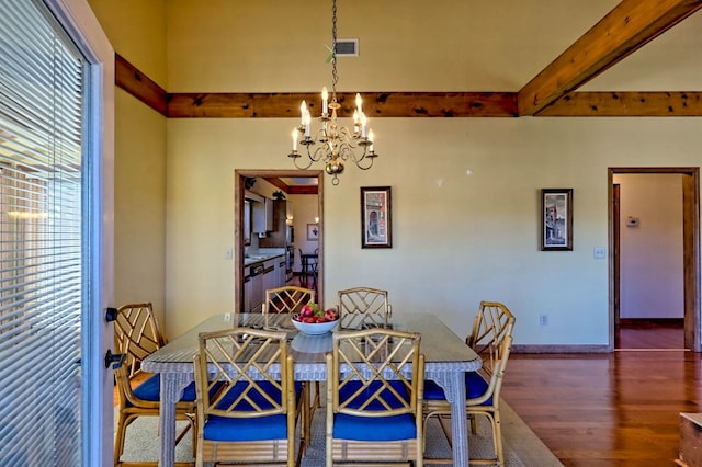 dining room with dark hardwood / wood-style flooring, a notable chandelier, and beam ceiling