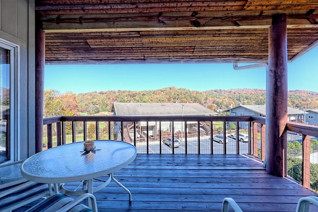 wooden terrace with a mountain view