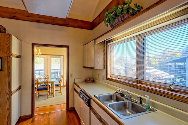 kitchen with sink, white cabinetry, white refrigerator, dishwasher, and hardwood / wood-style floors