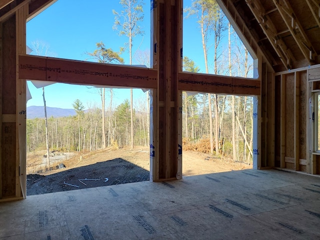 entryway with a high ceiling and a mountain view