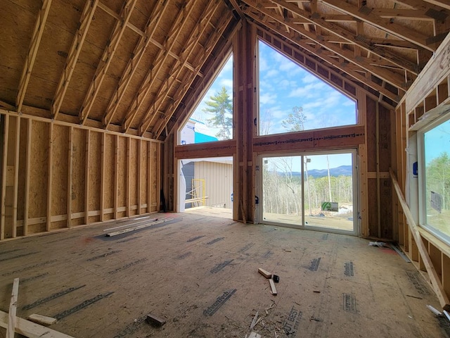 misc room with high vaulted ceiling