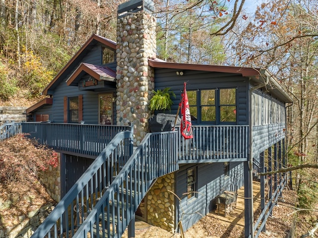 log-style house with a deck