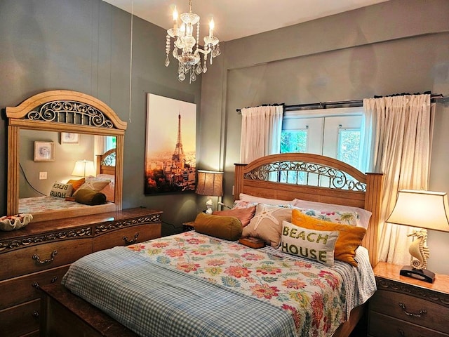 bedroom featuring a notable chandelier