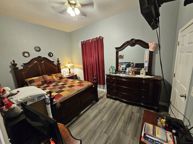 bedroom featuring ceiling fan and light hardwood / wood-style flooring