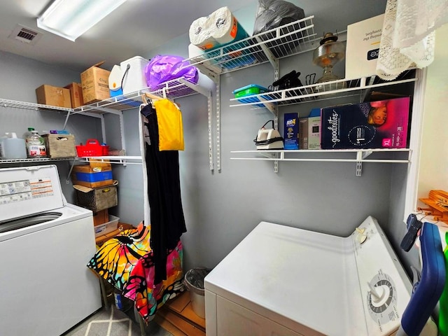 laundry area with washing machine and dryer