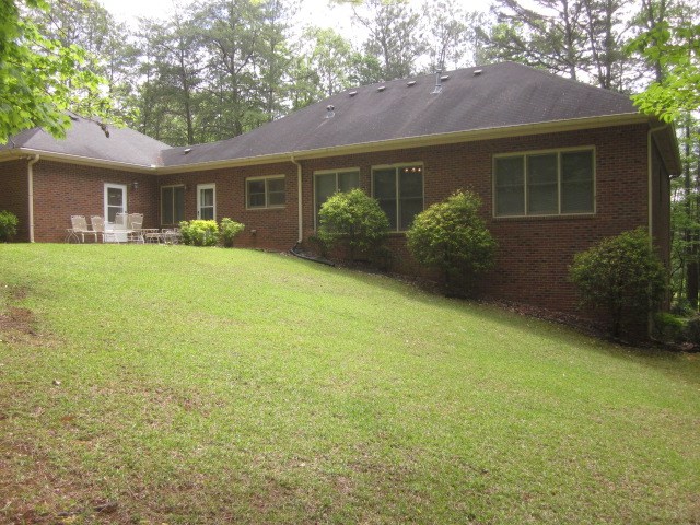629 Camp Branch Rd, Ellijay, GA 30540 - back of property with brick siding and a yard