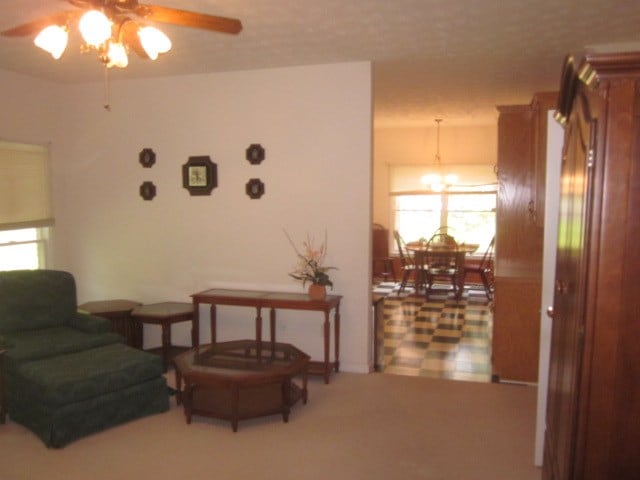 629 Camp Branch Rd, Ellijay, GA 30540 - sitting room with a ceiling fan and a chandelier